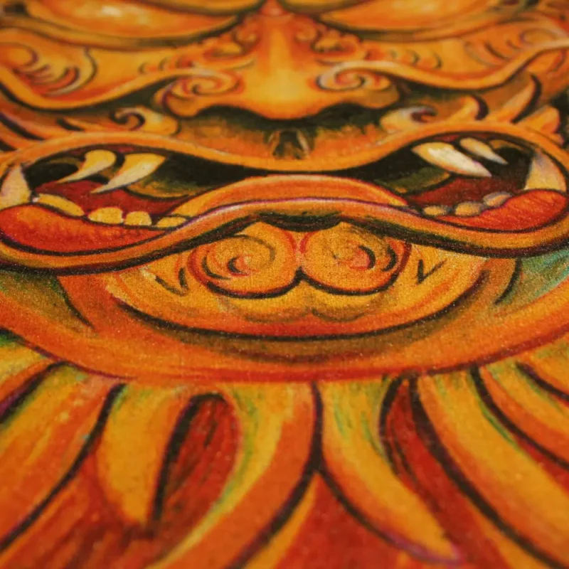 Close up from full colour DTG Print from yellow Hanya mask in tattoo style on black t-shirt