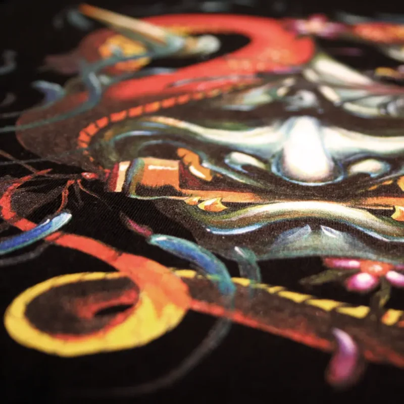 Close up from full colour DTG Print from Hanya mask in tattoo style on black t-shirt